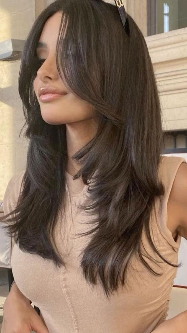 Face-Framing Wispy Bangs for Round Faces