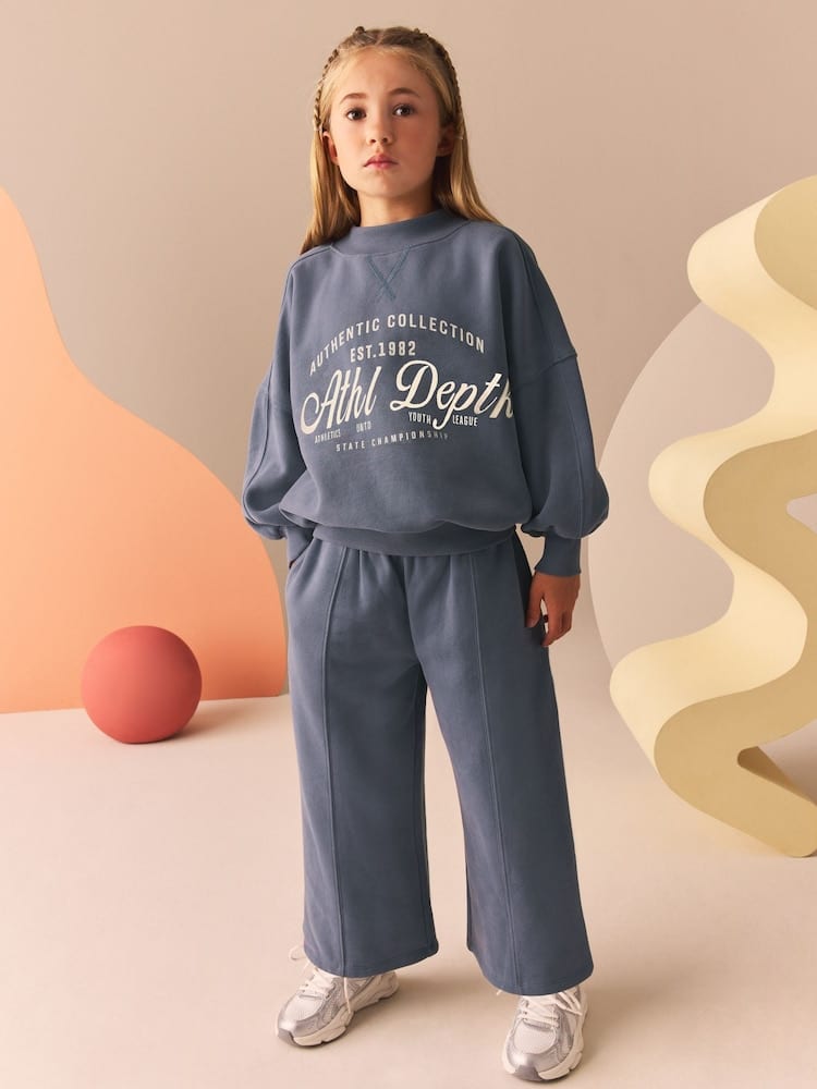 Tucked-In Graphic Sweatshirt Look