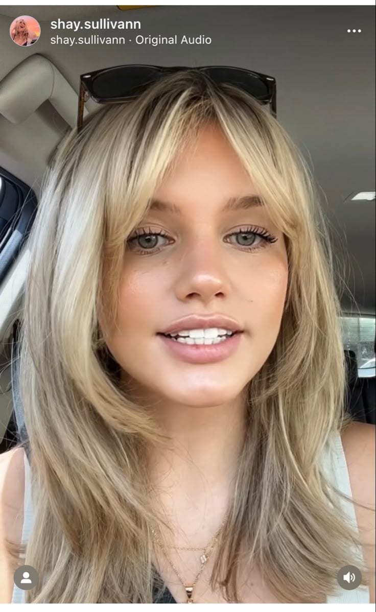 Wispy Curtain Bangs With a Middle Part