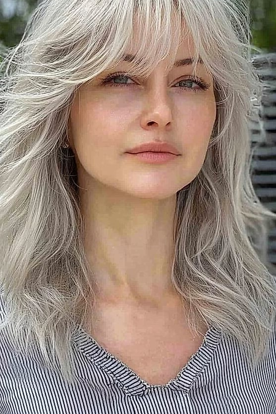 Wolf Cut With Bangs: 11 Ideas That Look So Good 2 Curtain Bangs With a Shaggy Wolf Cut