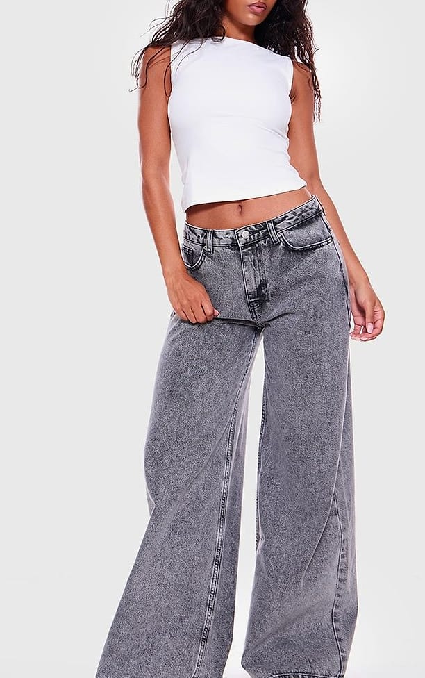 Grey Baggy Jeans with a White Fitted Tank and Sneakers
