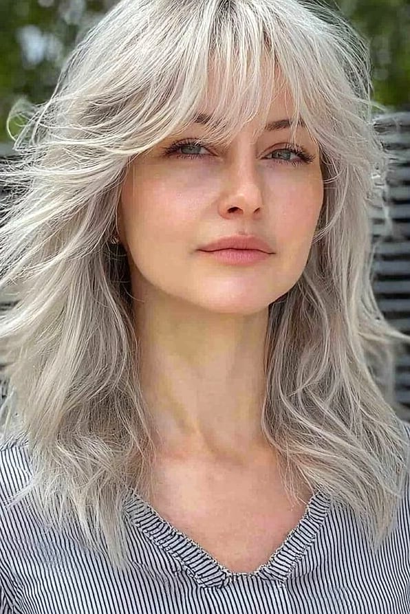 Wolf Cut With Bangs: 11 Ideas That Look So Good 6 Shaggy Wolf Cut With Full Fringe Bangs