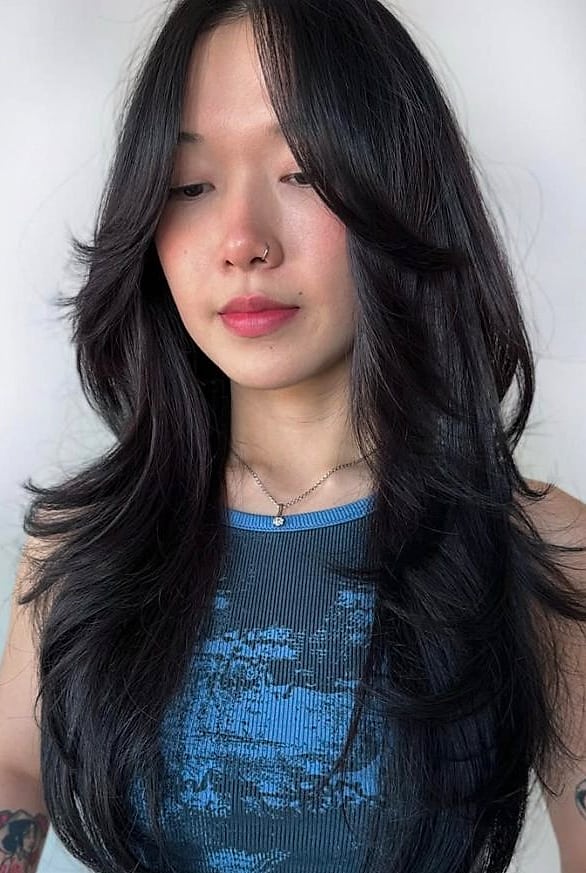 Wolf Cut With Bangs: 11 Ideas That Look So Good 7 Wolf Cut With Curtain Bangs in a Bold Color