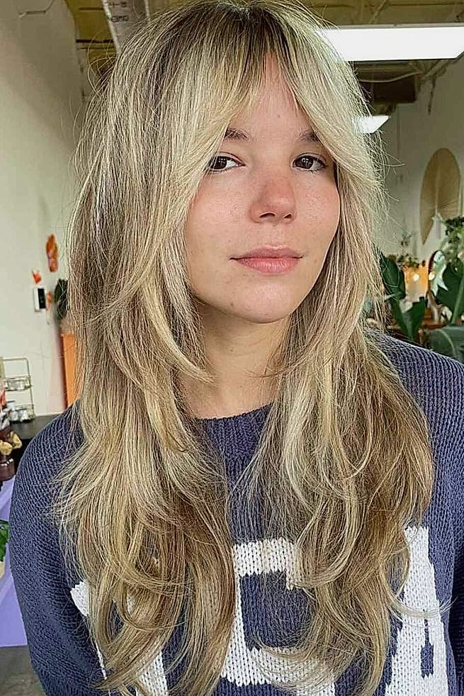 Wolf Cut With Bangs: 11 Ideas That Look So Good 11 Wolf Cut With Bangs and Face-Framing Highlights